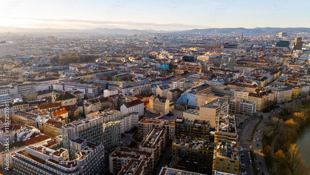 Vienna, Austria Aerial View: Sunset Over City Center and Canal. Top cinematic aerial view. 