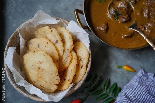 Ney Patha or Pathiri - Kerala Malabar breakfast served with Lamb curry photo