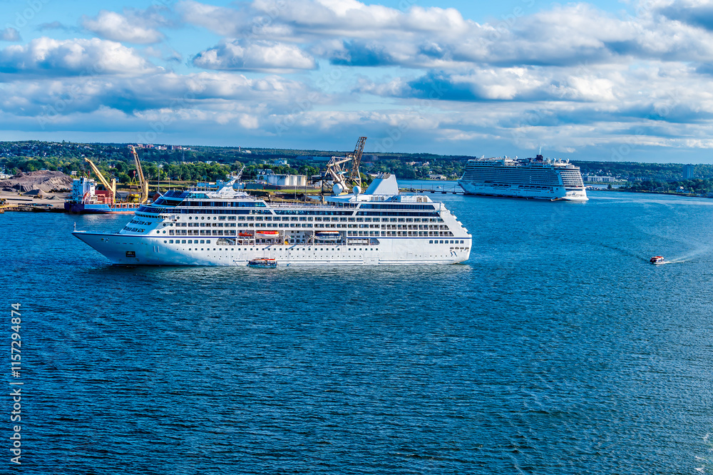 A panorama view of cruise ships in the bay at Sydney, Nova Scotia, Canada in the fall A panorama view of cruise ships in the bay at Sydney, Nova Scotia, Canada in the fall