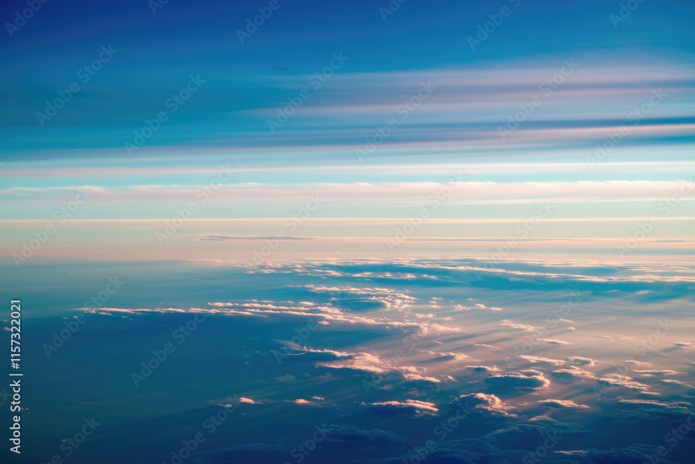 A breathtaking aerial view of a serene sunset, showcasing layers of clouds and a vibrant sky. A breathtaking aerial view of a serene sunset, showcasing layers of clouds and a vibrant sky.