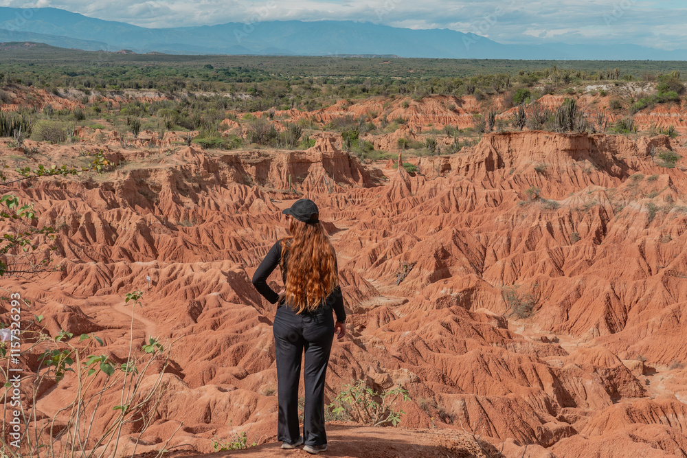 woman dressed in back in the tatacoa desert colombia woman dressed in back in the tatacoa desert colombia