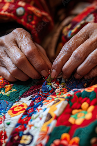 Close-up of a woman’s hands sewing traditional patterns, representing heritage and skill