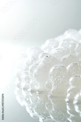 close-up of foamy cleanser bubble pattern displayed on reflective surface under bright lighting