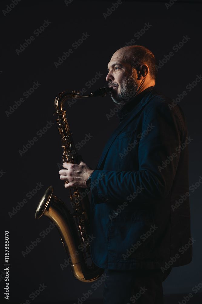 Naklejka premium Saxophonist in Spotlight Creating Melodic Harmony