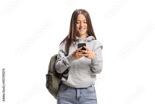 Female student typing on a mobile phone and smiling