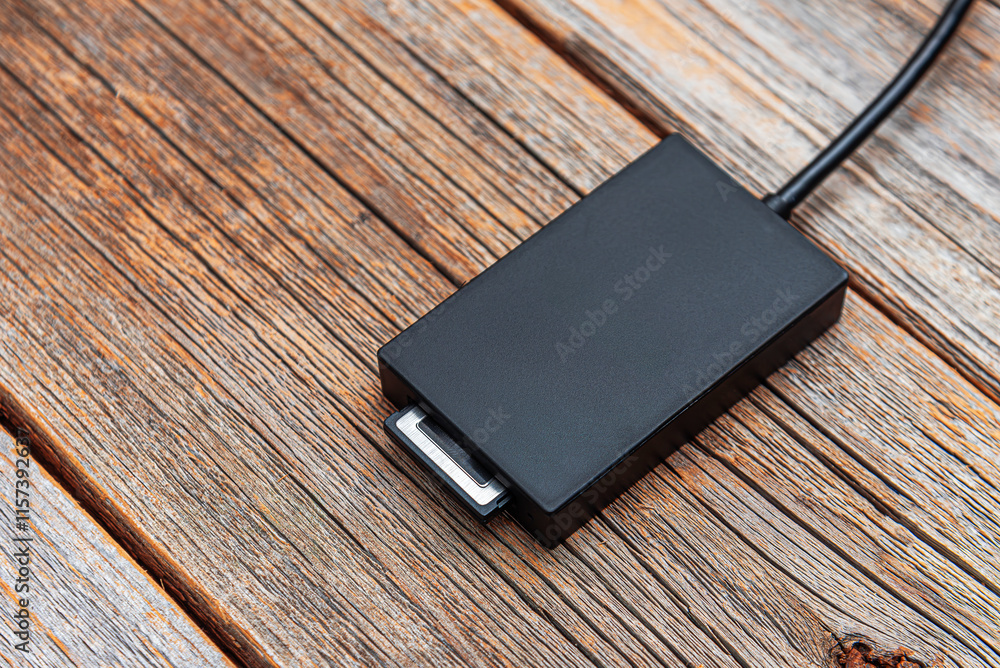 The card reader is connected to a mobile device: phone or tablet.