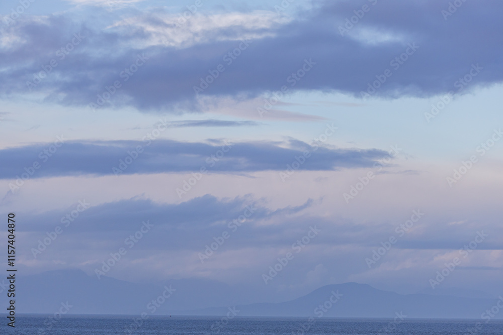 Scenic View of Tranquil Ocean Waters Under a Cloudy Blue Sky Scenic View of Tranquil Ocean Waters Under a Cloudy Blue Sky