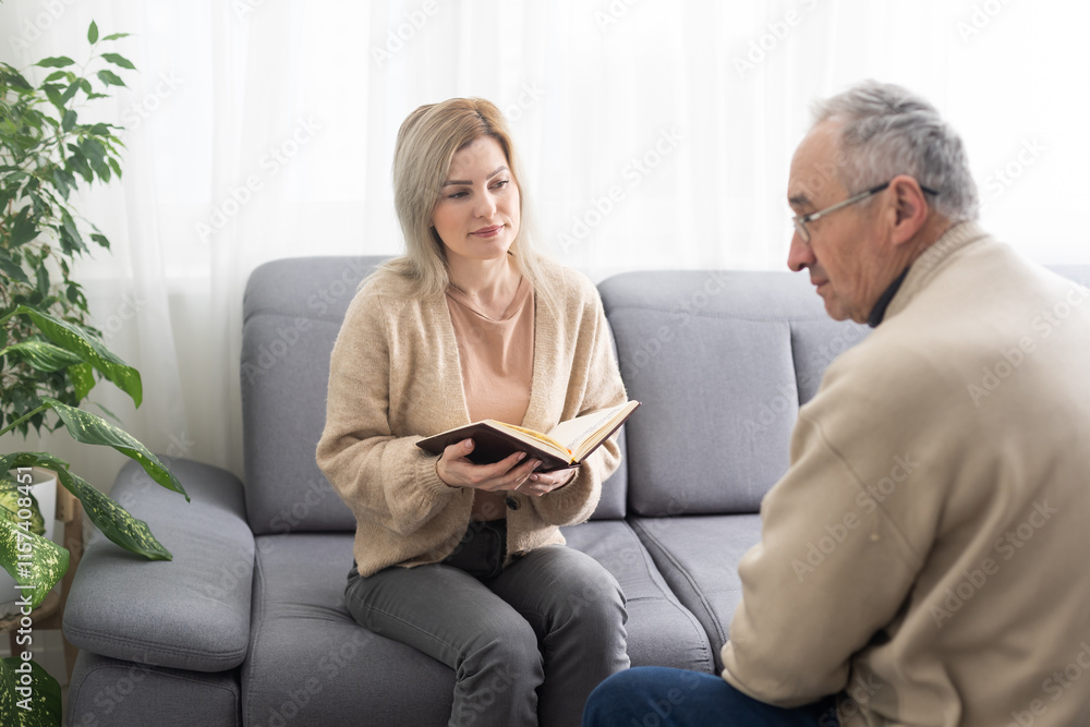 Fototapeta premium Image of young psychiatrist and her elder patient