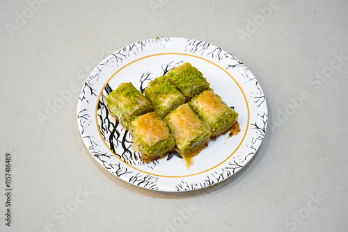 Turkish Dessert Sobiyet, havuc dilimi, midye baklava, mussels baklava and classic baklava with Pistachio . Cikolatali cevizli, fistikli soguk Baklava, top view. photo