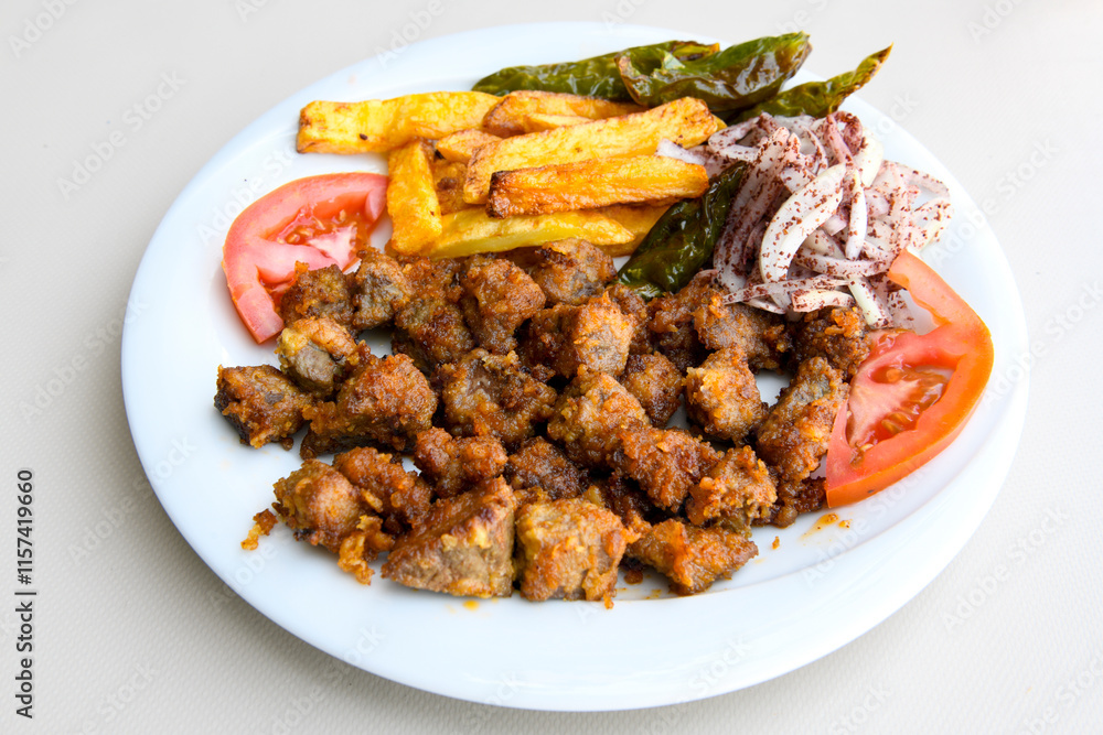 Famous Urfa meat liver, ciger wrapped by lavash with roasted chili pepper, onion and sauce in Sanliurfa, Turkey. Izgara kuzu et sis , kuzu ciger sis durum. Arnavut cigeri. Ciger sote. Tavuk cigeri. Famous Urfa meat liver, ciger wrapped by lavash with roasted chili pepper, onion and sauce in Sanliurfa, Turkey. Izgara kuzu et sis , kuzu ciger sis durum. Arnavut cigeri. Ciger sote. Tavuk cigeri.
