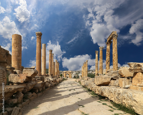 Roman Columns in the Jordanian city of Jerash (Gerasa of Antiquity), capital and largest city of Jerash Governorate, Jordan. Against the background of a beautiful sky with clouds #1157440219