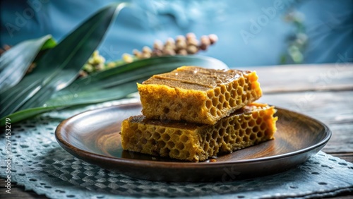 Sweet Medan nights: capture Bika Ambon's alluring honeycomb texture, a delectable Indonesian snack. photo