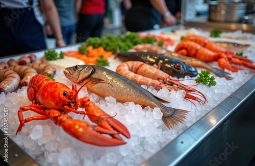 Fresh fish, seafood assortment displayed on ice. Lobster, octopus delicacies available for sale. Healthy mediterranean diet ingredients. Variety of fish like salmon, shrimp. High quality seafood. photo