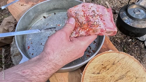 skewering meat at a picnic