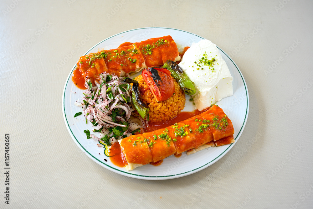 Famous Urfa meat liver, ciger wrapped by lavash with roasted chili pepper, onion and sauce in Sanliurfa, Turkey. Kuzu et ciger sis. Izgara dana bonfile, cop sis, kuzu pirzola. Karisik kebap, beyti keb Famous Urfa meat liver, ciger wrapped by lavash with roasted chili pepper, onion and sauce in Sanliurfa, Turkey. Kuzu et ciger sis. Izgara dana bonfile, cop sis, kuzu pirzola. Karisik kebap, beyti keb