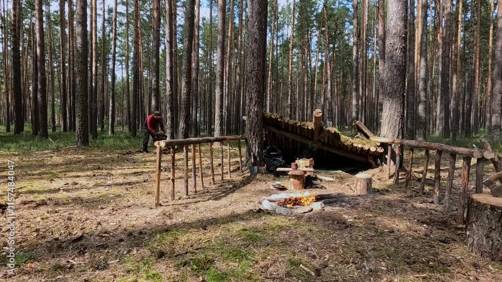 Man bushcrafts and survives in the forest Man bushcrafts and survives in the forest