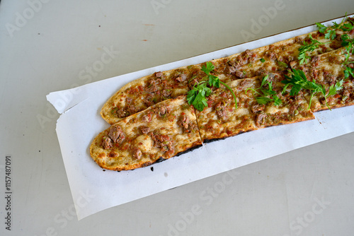 Kiymali pide. Turkish pide with minced meat. Turkish pizza mince pita Pide on white background. Etli ekmek. Kusbasi kasarli, kiymali kasarli, kiymali yumurtali, Bafra, Trabzon, Kusbasili pide. photo