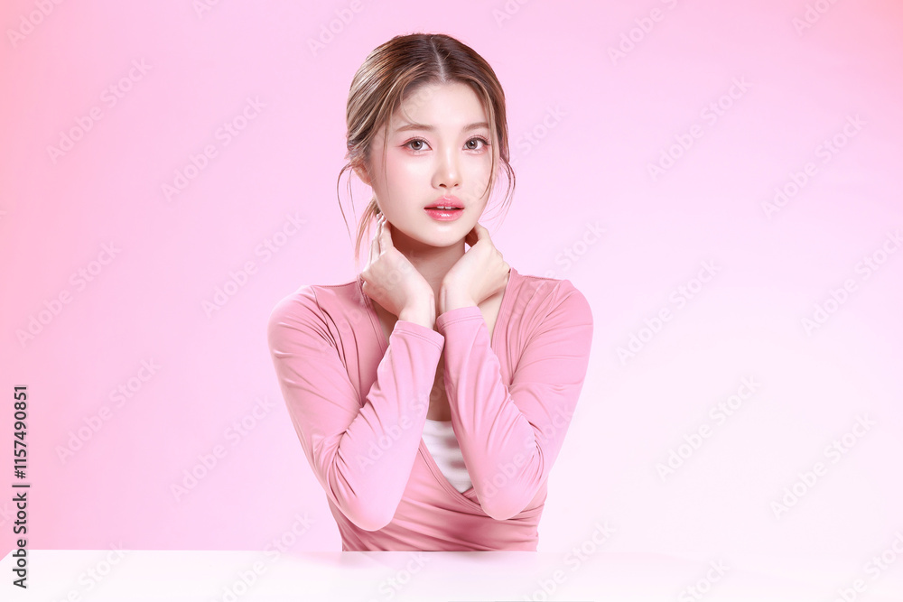 Portrait of a Smiling Asian Woman fresh skin in Stylish Pink Attire Against a Soft Background. Portrait of a Smiling Asian Woman fresh skin in Stylish Pink Attire Against a Soft Background.