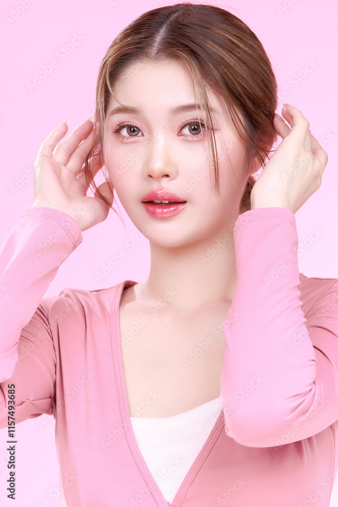 Portrait of a Smiling Asian Woman fresh skin in Stylish Pink Attire Against a Soft Background. Portrait of a Smiling Asian Woman fresh skin in Stylish Pink Attire Against a Soft Background.