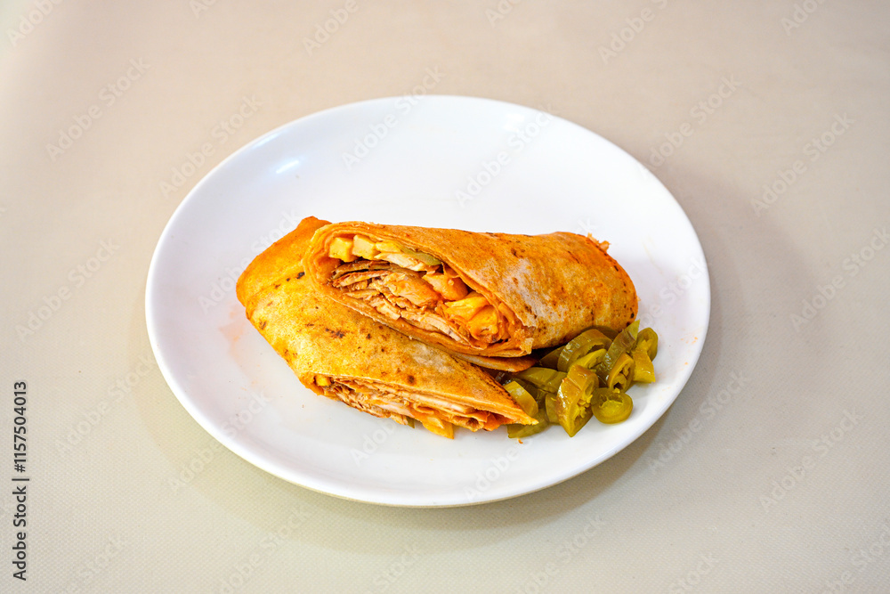 Lavash doner kebab ( soslu kasarli zurna doner durum ) or shawarma sliced in plate isolated. Tavuk Et Doner Durum. Hatay Iskenderun usulu bazuka tavuk doner durum. Lavash doner kebab ( soslu kasarli zurna doner durum ) or shawarma sliced in plate isolated. Tavuk Et Doner Durum. Hatay Iskenderun usulu bazuka tavuk doner durum.