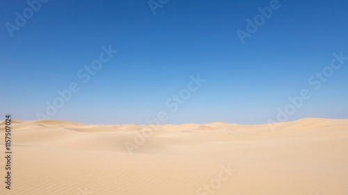 Vast and Serene Desert Landscape Under a Clear Blue Sky, Emphasizing the Beauty of Nature and the Harshness of Desert Environments and Sand Dunes