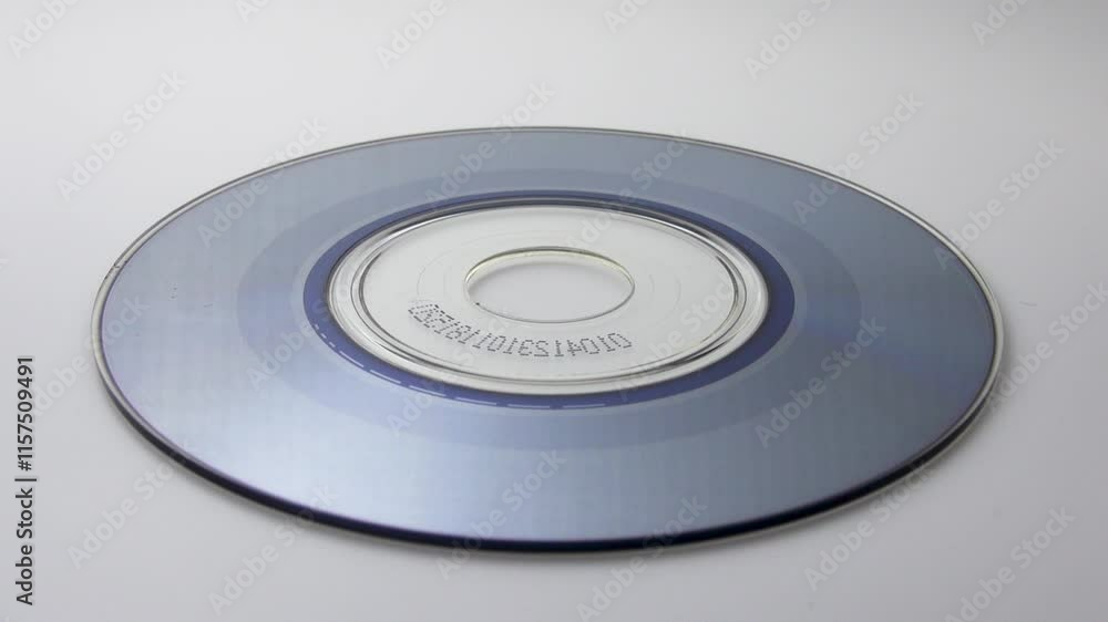Spinning CD on white background Spinning CD on white background