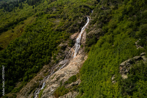 Beautiful view of a waterfall in the North Caucasus mountains. Landscape and nature of the North Caucasus photo