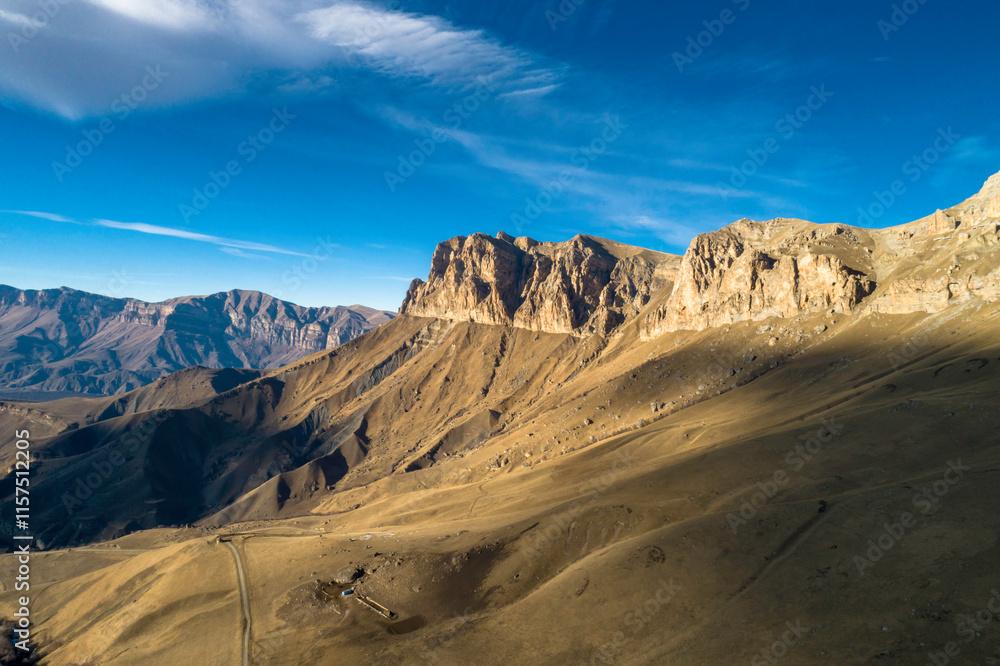 Beautiful aerial view of a mountain range with high cliffs. Landscape and nature of the North Caucasus Beautiful aerial view of a mountain range with high cliffs. Landscape and nature of the North Caucasus