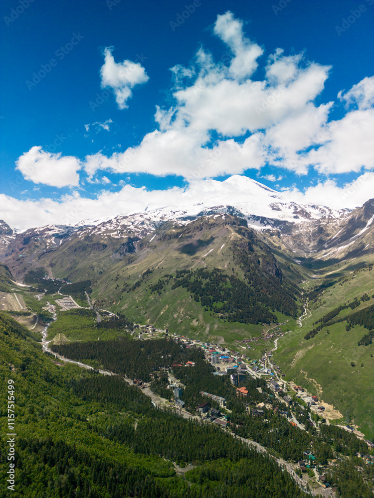 Aerial panorama overlooking mountain peaks. Landscape and nature of the North Caucasus Aerial panorama overlooking mountain peaks. Landscape and nature of the North Caucasus