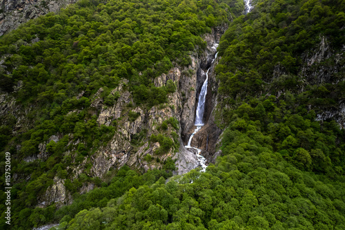 Beautiful view of a waterfall in the North Caucasus mountains. Landscape and nature of the North Caucasus photo