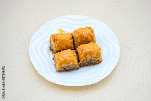 Turkish Dessert Sobiyet, havuc dilimi, midye baklava, mussels baklava and classic baklava with Pistachio . Cikolatali cevizli, fistikli soguk Baklava, top view. photo