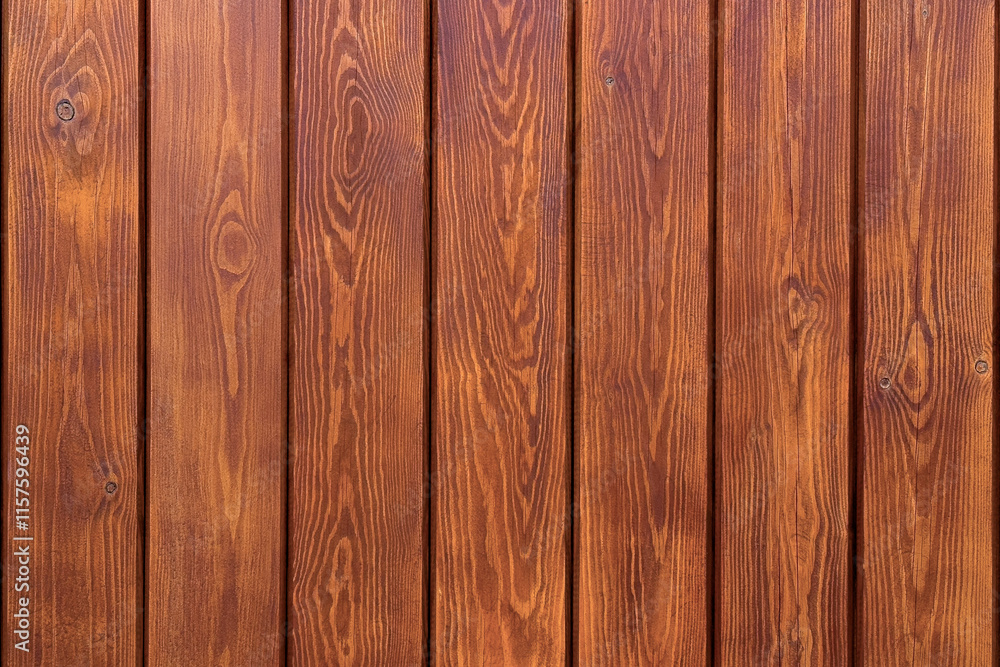 Fototapeta premium Wooden wall with warm brown planks featuring natural grain and knots. Rustic texture for design backgrounds