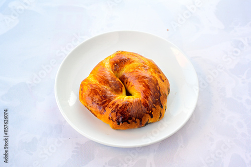 Turkish pastry product , tasty pogaca. Simit, gevrek. Turkish Pastries; peynirli, patatesli, kasarli pogaca, borek, acma, ay coregi at patisserie showcase. photo