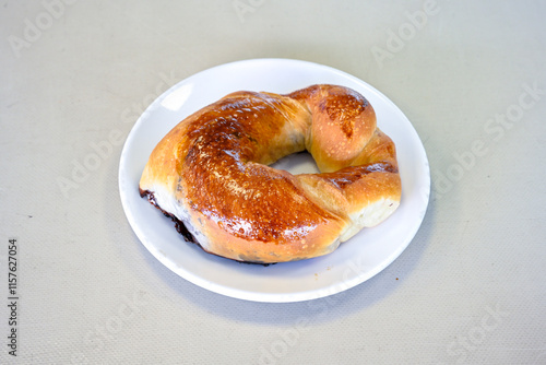 Turkish pastry product , tasty pogaca. Simit, gevrek. Turkish Pastries; peynirli, patatesli, kasarli pogaca, borek, acma, ay coregi at patisserie showcase. photo