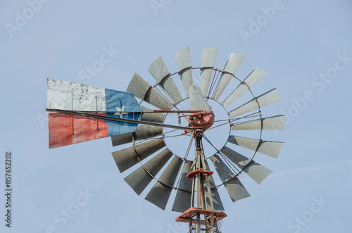Texas windmill with a painting of a Texas flag on it