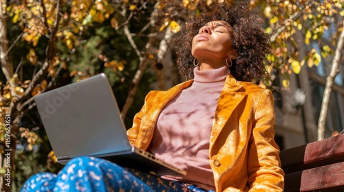 Professional Woman Relaxing Outdoors in Autumn Sunlight