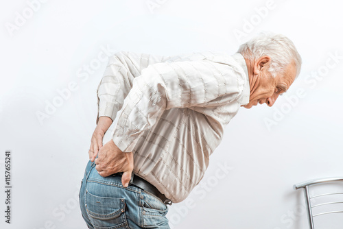 Bild auf Leinwand The older man grabbed his lower back