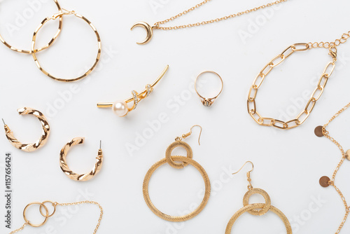Cuadro en lienzo Elegant golden jewelry with decoration on color background, top view