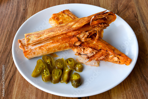 Lavash doner kebab ( soslu kasarli zurna doner durum )  or shawarma sliced in plate isolated.  Tavuk Et Doner Durum. Hatay Iskenderun usulu bazuka tavuk doner durum. photo