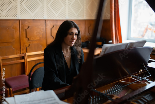 Pianist Performing in a Cozy Room with Focused Expression photo