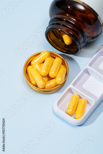Top view of medical pills in a bottle and organizer
