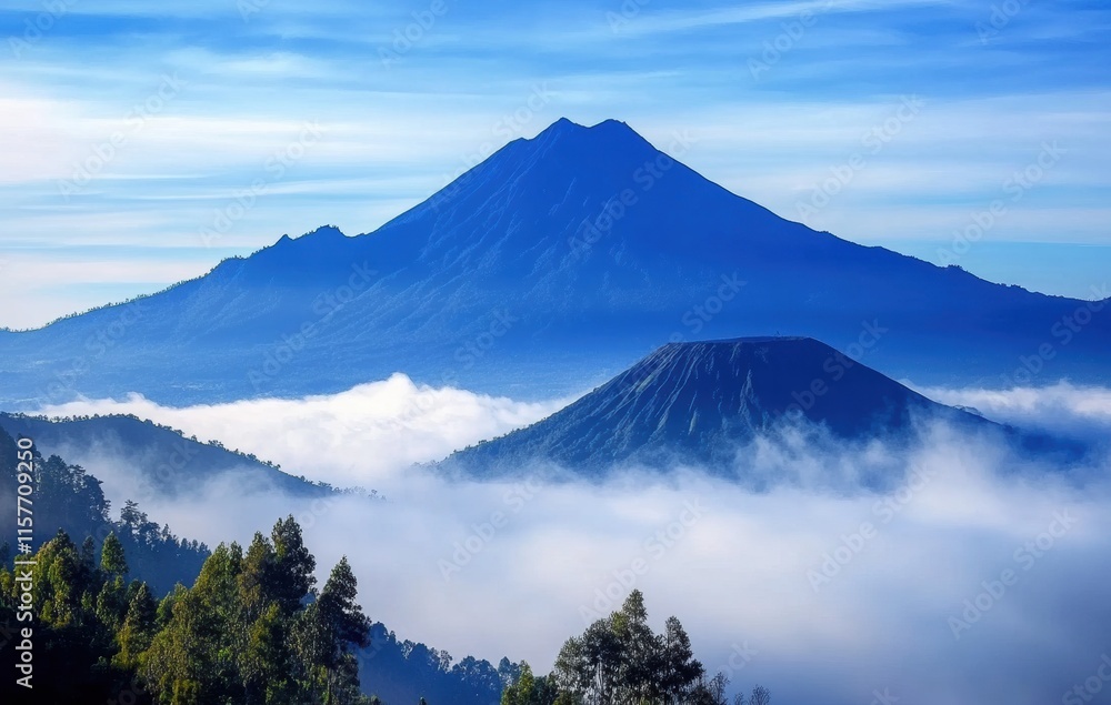 Fototapeta premium A mountain range with a volcano in the distance