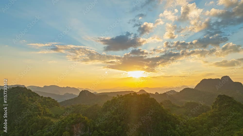 aerial hyper lapse a gorgeous sunrise. A panoramic view of dramatic mountain peaks silhouetted against a vibrant sunset sky, with fiery hues of red, orange, and pink blending into the fading blue. aerial hyper lapse a gorgeous sunrise. A panoramic view of dramatic mountain peaks silhouetted against a vibrant sunset sky, with fiery hues of red, orange, and pink blending into the fading blue.