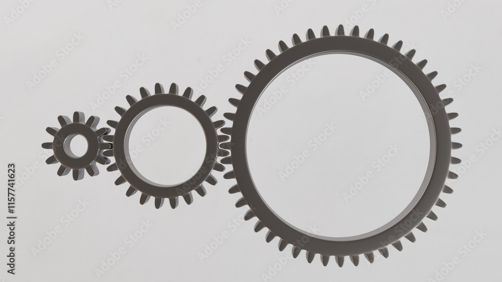 Three metallic gears in shades of gray, of different sizes, arranged in a line on a white background. Ideal for applications in engineering, industry, education and technical presentations. Three metallic gears in shades of gray, of different sizes, arranged in a line on a white background. Ideal for applications in engineering, industry, education and technical presentations.