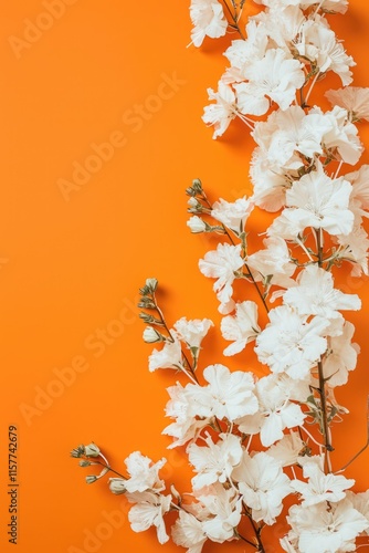 White Kalia Flowers on Vibrant Orange Background: Vertical Floral Beauty with Copy Space photo