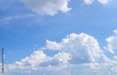 Tableau sur toile White fluffy clouds, sun and blue sky. Majestic view in summer.