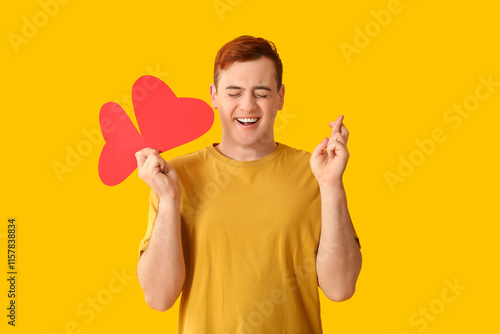 Young man with red paper he...