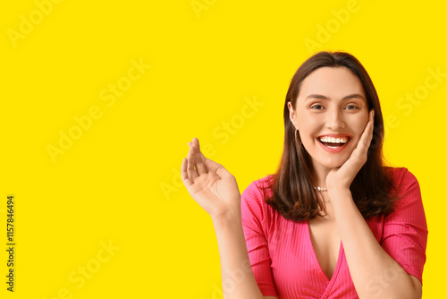 Smiling young woman on yell...