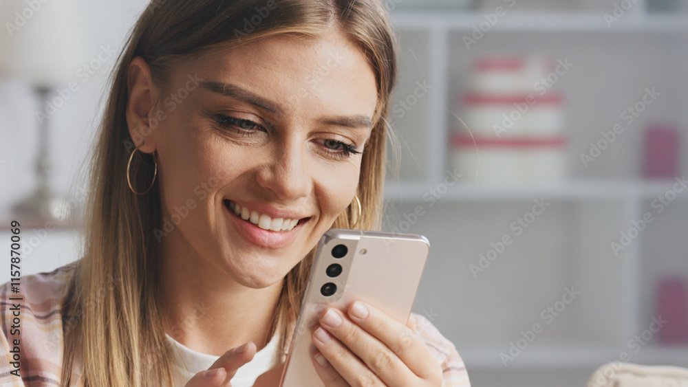 Young woman using mobile phone at home, browsing internet, chatting online, watching video, working or studying, relaxing on sofa, smiling and enjoying leisure time Young woman using mobile phone at home, browsing internet, chatting online, watching video, working or studying, relaxing on sofa, smiling and enjoying leisure time