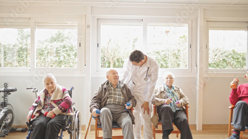 Group of seniors engaging in physical therapy in a sunlit exercise room.